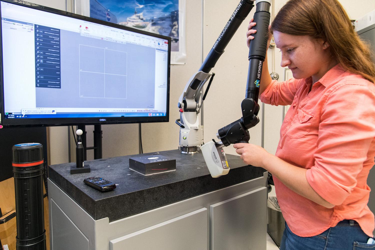 博彩网址大全女校友, Megan Janiak, working at NASA's Kennedy Space Center during her internship.